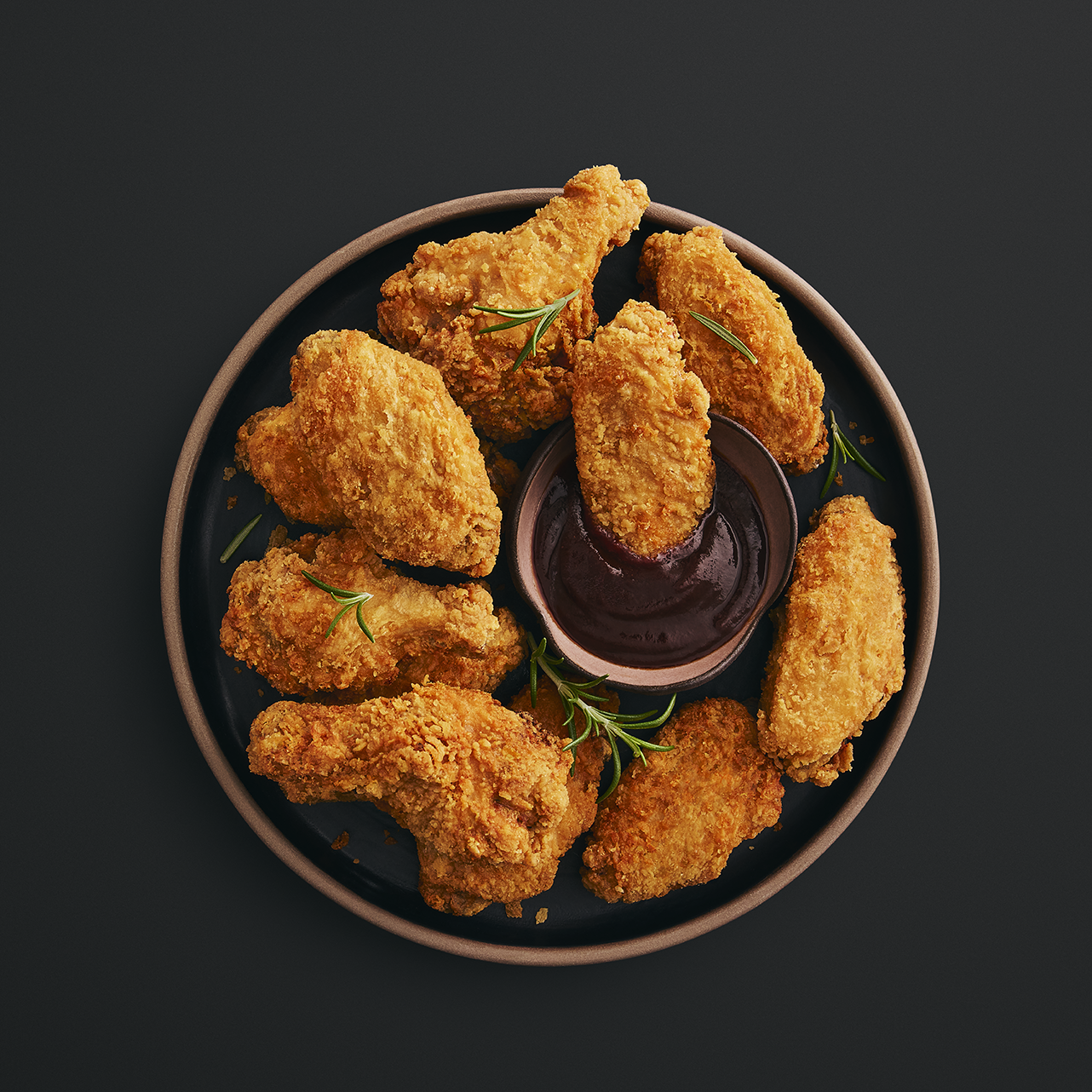 Chicken wings on a plate with stout beer sauce