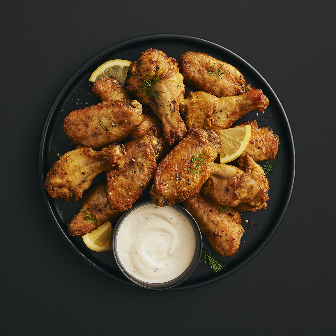 Ailes de poulet citron et poivre avec sauce